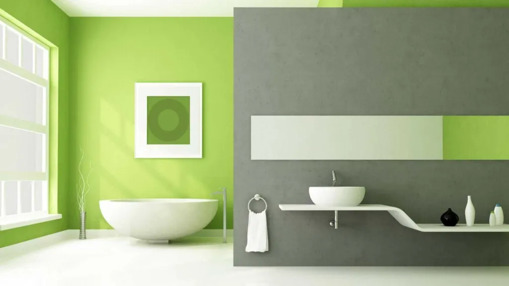 Bathroom with a green feature wall and a white freestanding bath