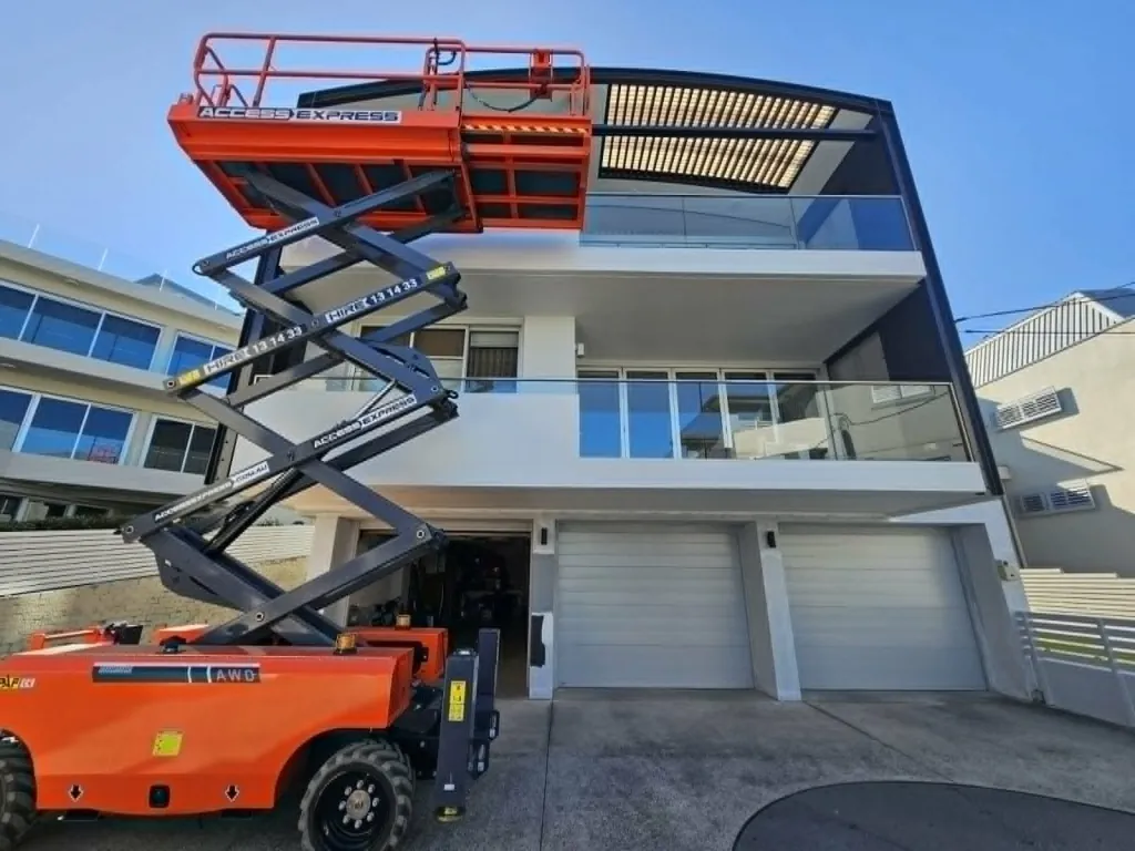 Multi-storey house exterior repaint using a scissor lift