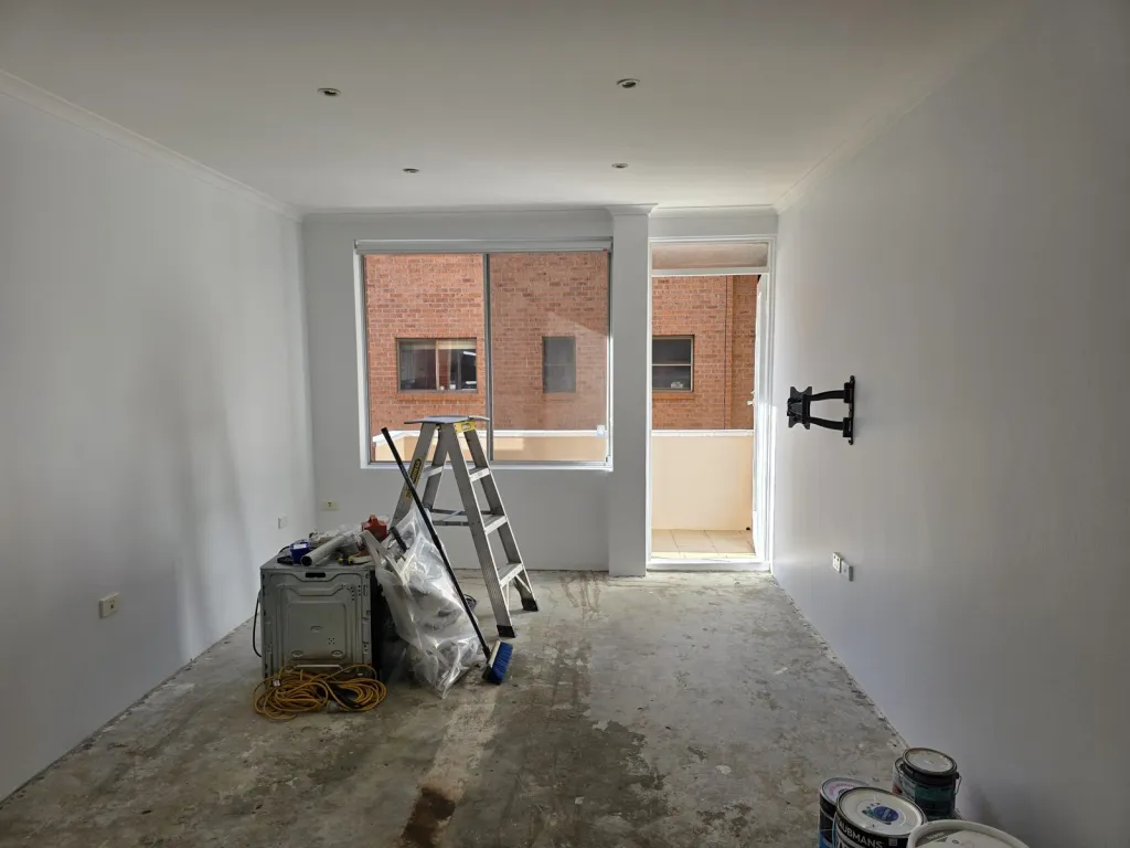 Unit living room walls and ceiling repainted white
