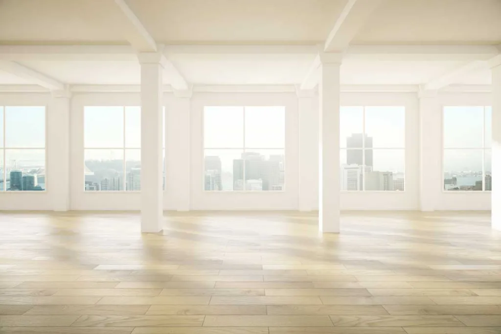 Bright empty office floor with freshly painted white walls