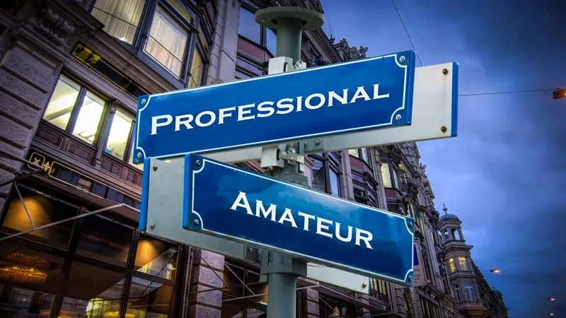 Street signs pointing to "Professional" and "Amateur"
