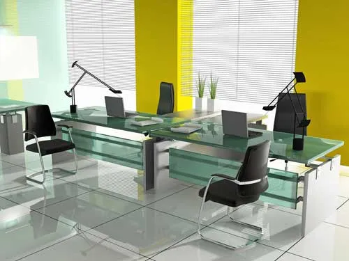 Modern office with glass desks and yellow and white walls